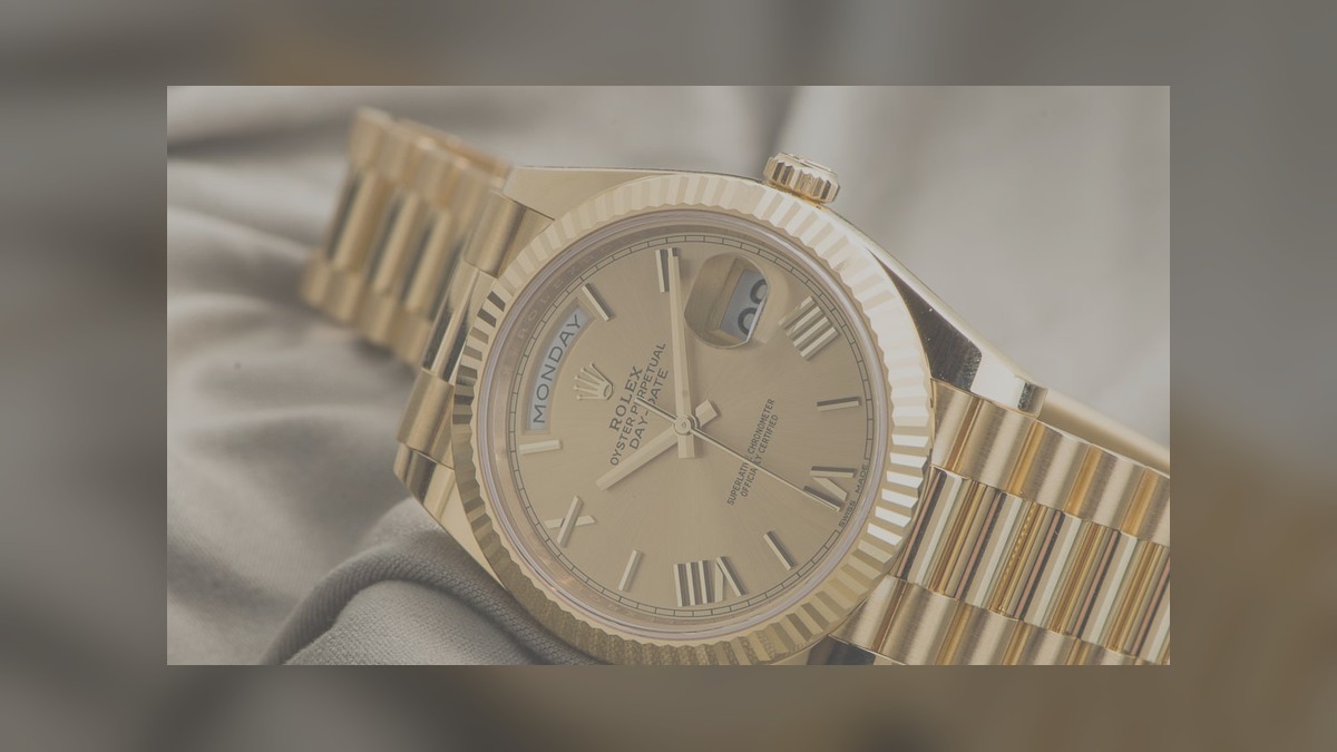 Day-Date style watch illustrating compact case, fluted bezel and President-style bracelet proportions